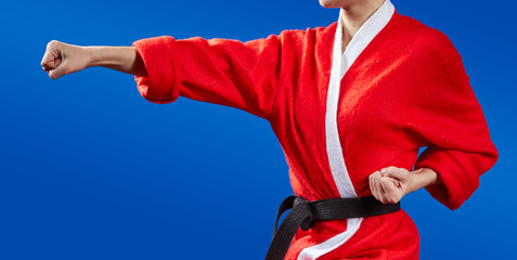 Girl in Santa Claus clothes doing karate kick © andreyfire