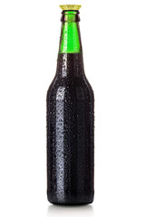 Bottle of beer with drops isolated on white