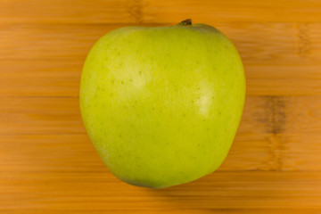 Apple on wooden background
