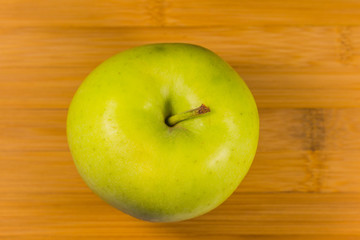 Apple on wooden background