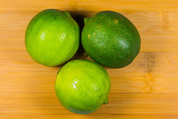 Close up tropic fruits lime on the wood table