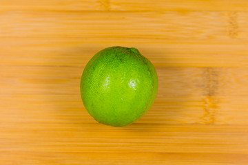 Close up tropic fruits lime on the wood table