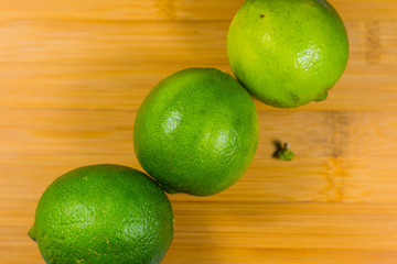 Close up tropic fruits lime on the wood table