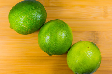 Close up tropic fruits lime on the wood table