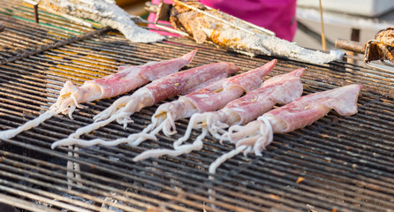 Octopus grilling on fire.