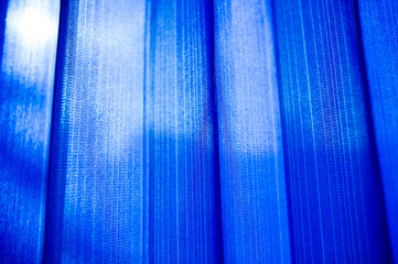 Blue curtains shading the sun.