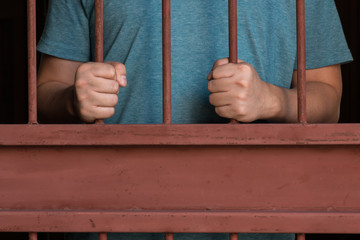 Woman hand in jail