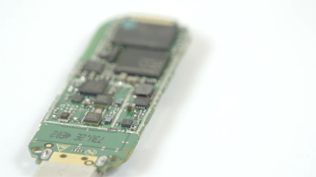 USB stick small chipset in a turn around view. Seen is the small chips and transistors inside the USB stick