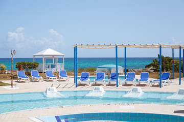 Cayo Coco island, Cuba, Sep 2, 2015 beautiful inviting amazing gorgeous view of outdoor spa swimming pool and grounds against tranquil ocean background on summer great sunny day