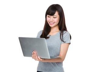 Asian Young woman watch on the laptop computer