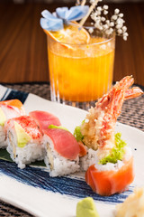 sushi plate and a cocktail in a japanese restaurant