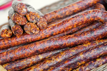 Fototapeta premium Homemade delicious smoked sausages in market. Traditional food
