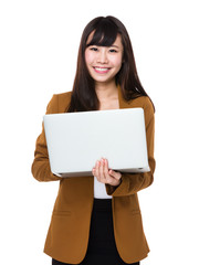 Asian Young Businesswoman use of the laptop computer