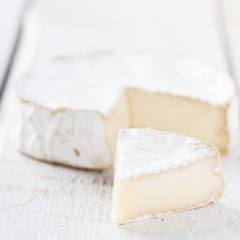 Brie cheese on white background.selective focus.