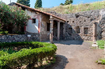Fototapeta na wymiar Remains of casa di apollo in Pompeii Italy. Pompeii was destroye