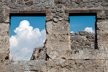 Remains of windows in antique wall in Pompeii. Pompeii was destr