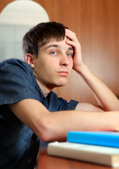 Sad Young Man with the Books