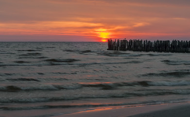 Wooden broken marine pier at dawn, Baltic Sea 