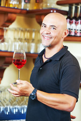 Sommelier barman with glass of water 