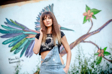 beautiful girl in denim overalls