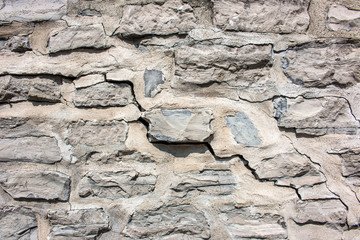 Hintergrund – Riss in Natursteinmauer