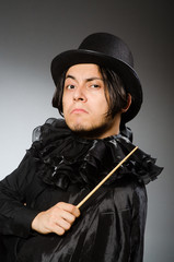 Funny magician wearing cylinder hat