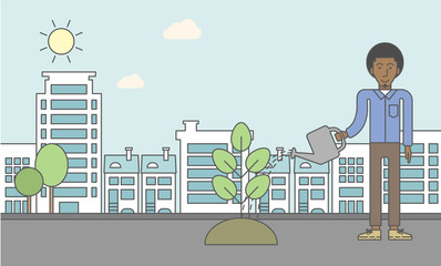 Obraz premium Man watering tree.