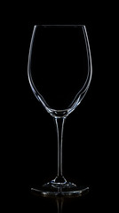 Empty white wine glass on a black