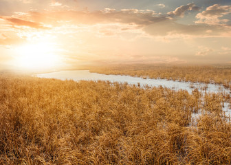 quiet sunset over a frozen river