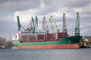 Fototapeta premium Large cargo ship in a dock at port