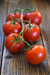 Close-up of fresh tomatoes on wooden background
