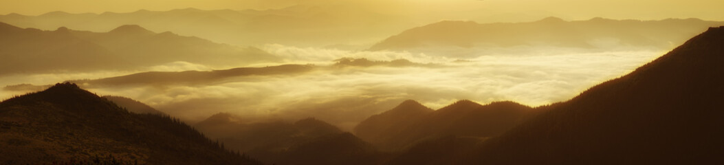 Fototapeta na wymiar Mountain foggy sunrise