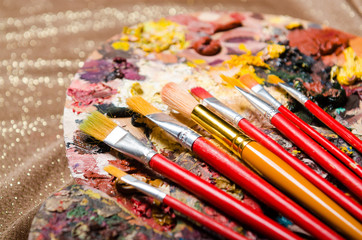Obraz premium Art concept with palette and brushes