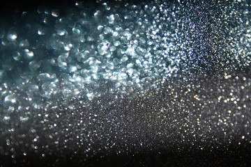 Naklejka na ściany i meble glitter vintage lights background. light silver, blue and black. defocused. abstract.