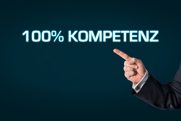 Business man pointing at the words 100% competence