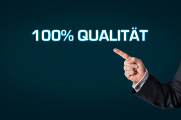 Business man pointing at the words 100% Quality
