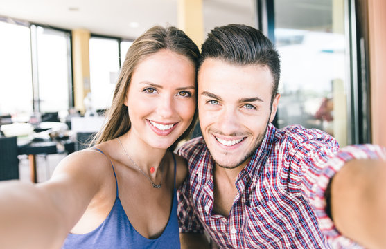 Couple taking self portrait with smart phone