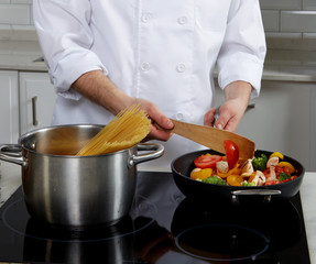 Chef preparing different dishes