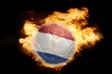 Fototapeta premium football ball with the flag of netherlands on fire