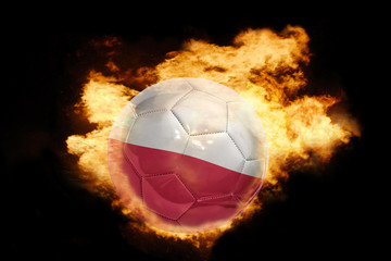 Fototapeta premium football ball with the flag of poland on fire