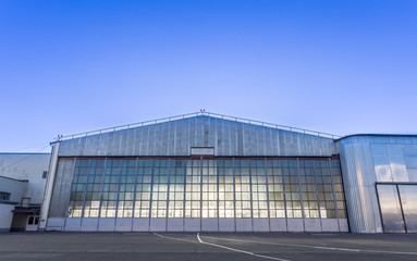 Fototapeta na wymiar Large aircraft hangar for planes