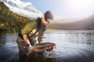 Fotobehang Trout-fishing on mountain river © vitaliy_melnik