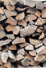 Fototapeta premium Dry Firewood Logs in a Stack. Background