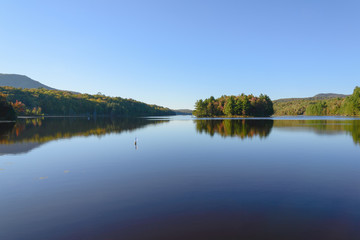 Fototapeta na wymiar Autumn forest and lake with reflection