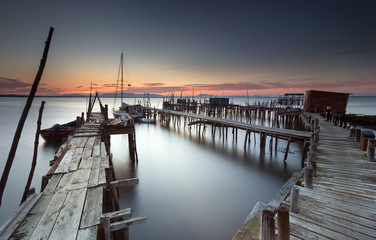 Twilight at an ancient fishing dock - 94367531