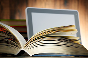 Composition with books and tablet computer