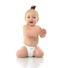 Infant baby toddler sitting on her knees and happy smiling