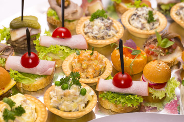 Canapes of cheese vegetables meat and seafood