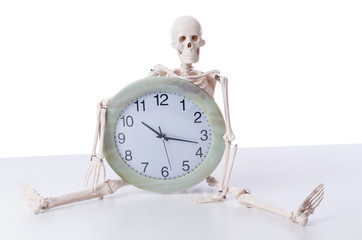 Skeleton with clock isolated on white