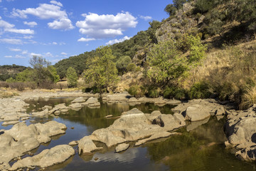 Fototapeta na wymiar Countryside landscape scenic view of a fresh water stream in Alentejo region.